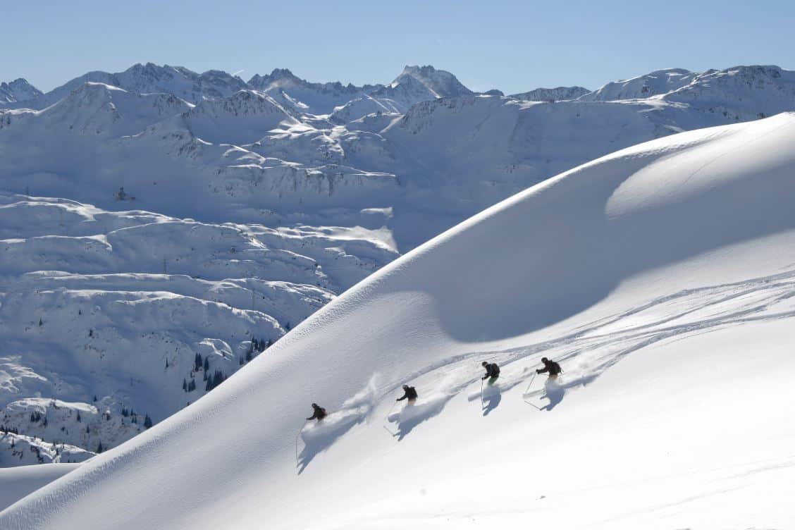 Powder skiing mountain backdrop